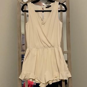 Cream V-neck Romper with Ruffle Detail on Legs